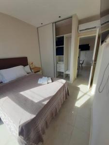 a bedroom with a large bed in a room at Apart El Carau in Corrientes