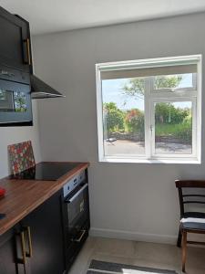 Η κουζίνα ή μικρή κουζίνα στο Dingle Escape -2 Bed -Sleeps 4