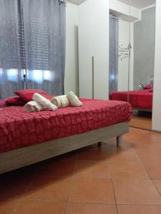 a bed with two people laying on top of it at Irnohouse in Salerno