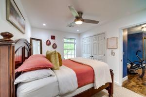 a bedroom with a bed and a ceiling fan at Peace and Tranquility Home 2 Mi to Dtwn Tulsa! in Tulsa