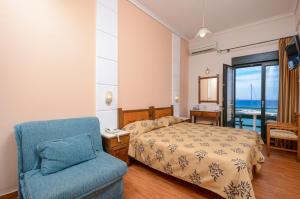 Postel nebo postele na pokoji v ubytování Hotel Coronis