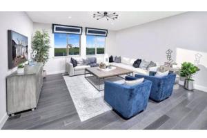 a living room with couches and a table at Cozy Roseville Home in Roseville