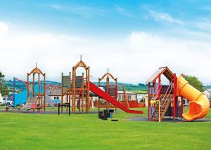 a playground with a slide and a slide at Lyons Manor House in Maryport