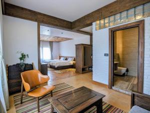 Ein Bett oder Betten in einem Zimmer der Unterkunft Uma Residence and Suites