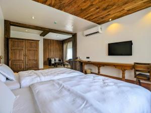 TV/Unterhaltungsangebot in der Unterkunft Uma Residence and Suites