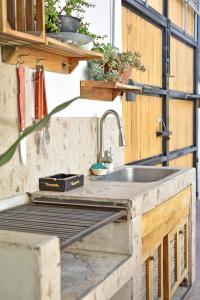 a kitchen with a sink and a counter top at Casa Palo Verde in Cabo San Lucas +28 photos