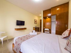 Een bed of bedden in een kamer bij Ananda's Sanur by ABM