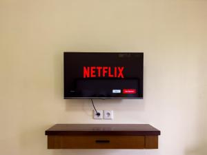 Een TV en/of entertainmentcenter bij Ananda's Sanur by ABM
