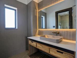 Ein Badezimmer in der Unterkunft Uma Residence and Suites