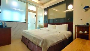 Postel nebo postele na pokoji v ubytování Jin Yong Quan Spa Hotspring Resort