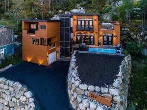 an aerial view of a house with a swimming pool at Luxury Halifax Waterfront Paradise -Pool, Hot Tub, Private Wharf, Boathouse, Backyard Oasis, Lookout in Halifax