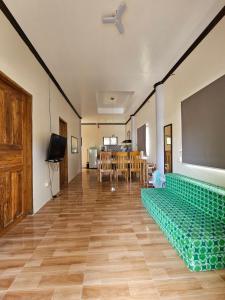 a room with a classroom with a table and a chalkboard at La Casita Camiguin -2BR Home, Starlink Wifi, Sleeps 9 in Catarman