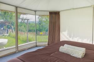 Postel nebo postele na pokoji v ubytování Polestay Glamping Kintamani