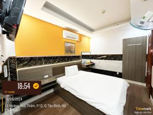 Postel nebo postele na pokoji v ubytování Phúc Khang Hotel Airport