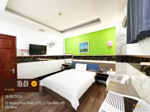 Postel nebo postele na pokoji v ubytování Phúc Khang Hotel Airport