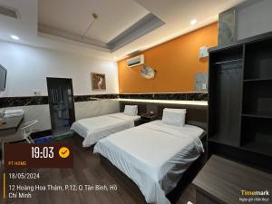 Postel nebo postele na pokoji v ubytování Phúc Khang Hotel Airport