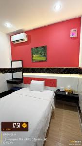 Postel nebo postele na pokoji v ubytování Phúc Khang Hotel Airport