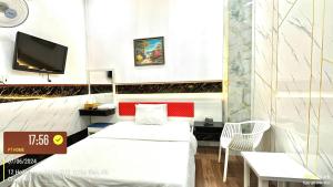 Postel nebo postele na pokoji v ubytování Phúc Khang Hotel Airport