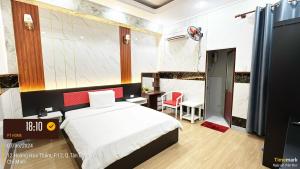 Postel nebo postele na pokoji v ubytování Phúc Khang Hotel Airport