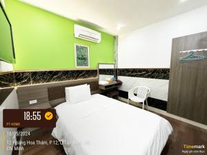 Postel nebo postele na pokoji v ubytování Phúc Khang Hotel Airport