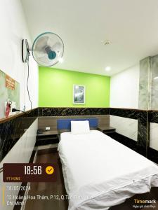 Postel nebo postele na pokoji v ubytování Phúc Khang Hotel Airport