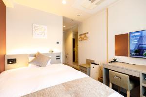 Postel nebo postele na pokoji v ubytování Inuyama Miyako Hotel
