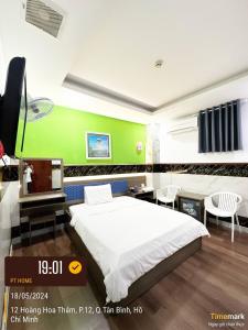 Postel nebo postele na pokoji v ubytování Phúc Khang Hotel Airport + 29 fotografií