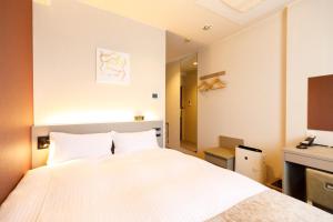 Postel nebo postele na pokoji v ubytování Inuyama Miyako Hotel
