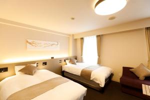 Postel nebo postele na pokoji v ubytování Inuyama Miyako Hotel