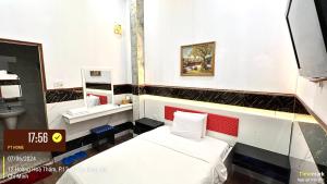 Postel nebo postele na pokoji v ubytování Phúc Khang Hotel Airport