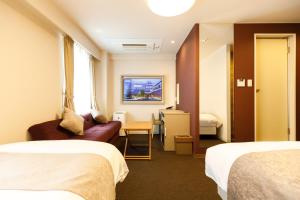 Postel nebo postele na pokoji v ubytování Inuyama Miyako Hotel