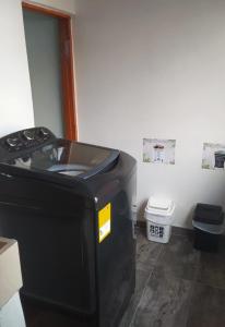 a machine sitting in a room with a toilet at Apartamento muy cerca al parque in Jardin