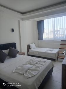 Ένα ή περισσότερα κρεβάτια σε δωμάτιο στο Sea Door Hotel +15 φωτογραφίες