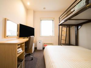 Postel nebo postele na pokoji v ubytování Super Hotel Kitami