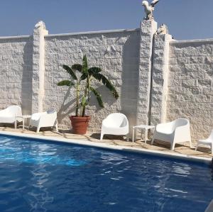 Bazén v ubytovaní Hotel Matalascañas alebo v jeho blízkosti