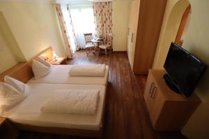 TV o dispositivi per l'intrattenimento presso Ferienhotel Fuchs