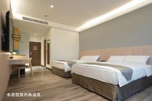 Voodi või voodid majutusasutuse Hoya Hot Springs Resort, Guanziling toas