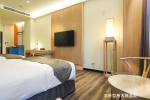 Voodi või voodid majutusasutuse Hoya Hot Springs Resort, Guanziling toas