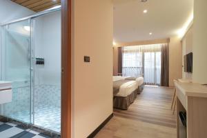 Vannituba majutusasutuses Hoya Hot Springs Resort, Guanziling