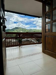 an open door to a balcony with a view at Apartamento cerca al parque in Jardin