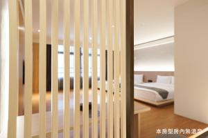 Voodi või voodid majutusasutuse Hoya Hot Springs Resort, Guanziling toas