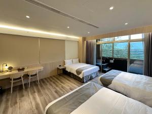 Voodi või voodid majutusasutuse Hoya Hot Springs Resort, Guanziling toas