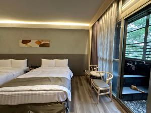 Voodi või voodid majutusasutuse Hoya Hot Springs Resort, Guanziling toas