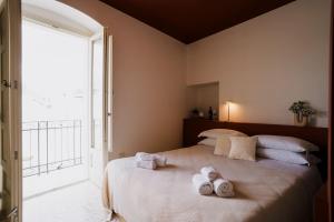 Postel nebo postele na pokoji v ubytování Palazzo D'Azeglio