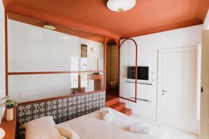 Postel nebo postele na pokoji v ubytování Palazzo D'Azeglio