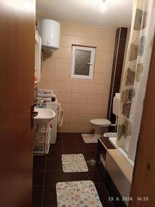 a bathroom with a sink and a toilet at 3-Bedroom NewHome in Mostar