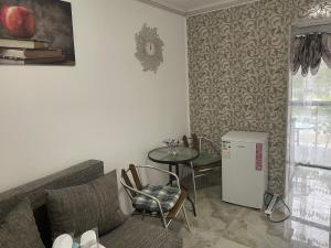 a living room with a couch and a table at Beta Residence Saturn in Mangalia