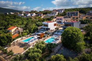an aerial view of a villa with a swimming pool at Luxusvilla Moana mit Olivenhain in Vrbnik