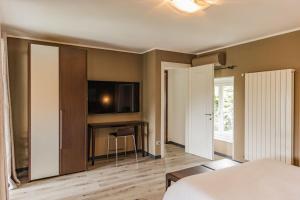 TV a/nebo společenská místnost v ubytování Villa Antica Colonia SPA & Wellness
