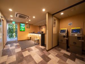 an office with a lobby with a video game at Super Hotel Sapporo Susukino in Sapporo